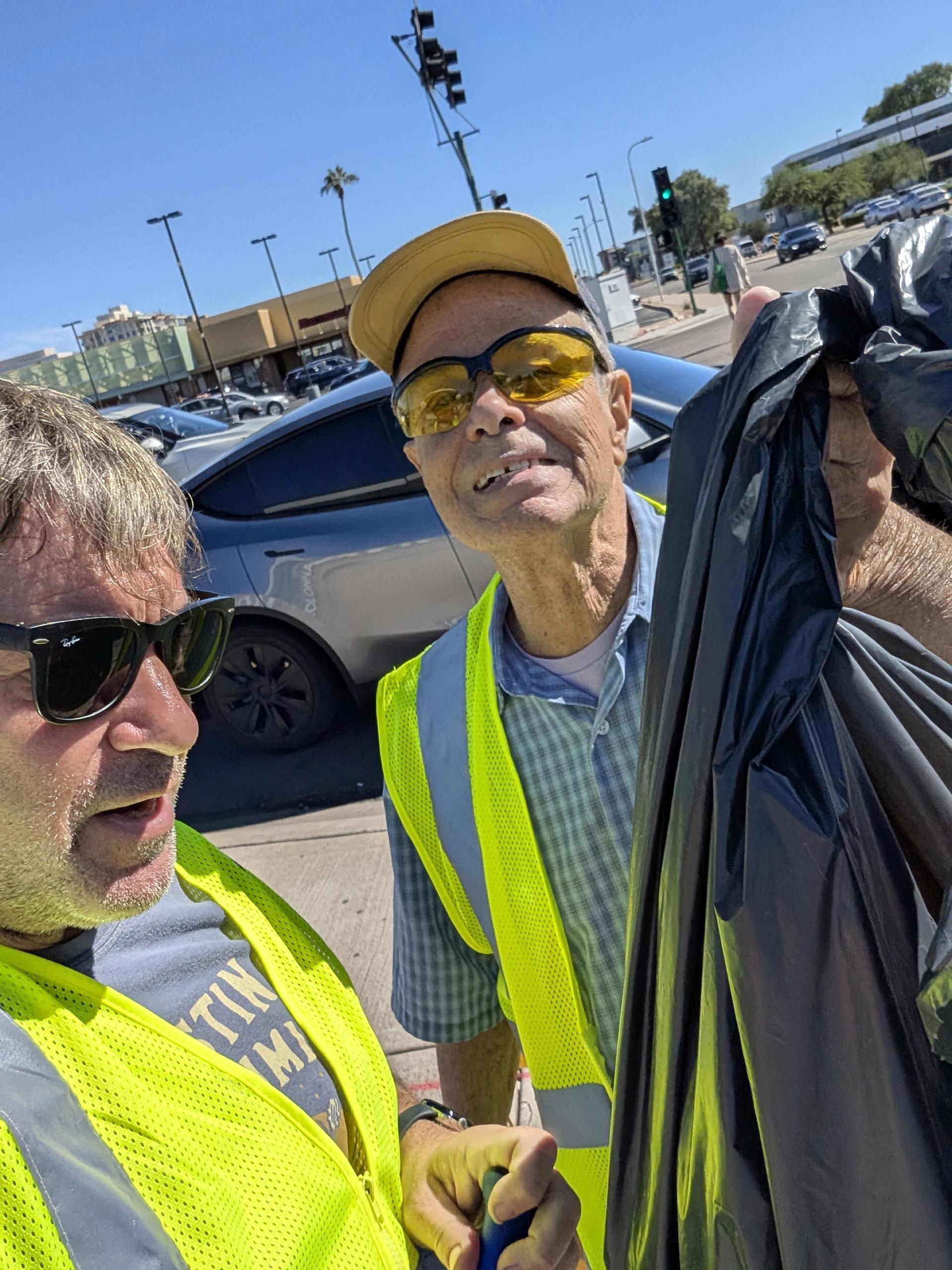 Christopher Alghini and Frank Scalise, 87, after a successful cleanup on 20th Street in Phoenix