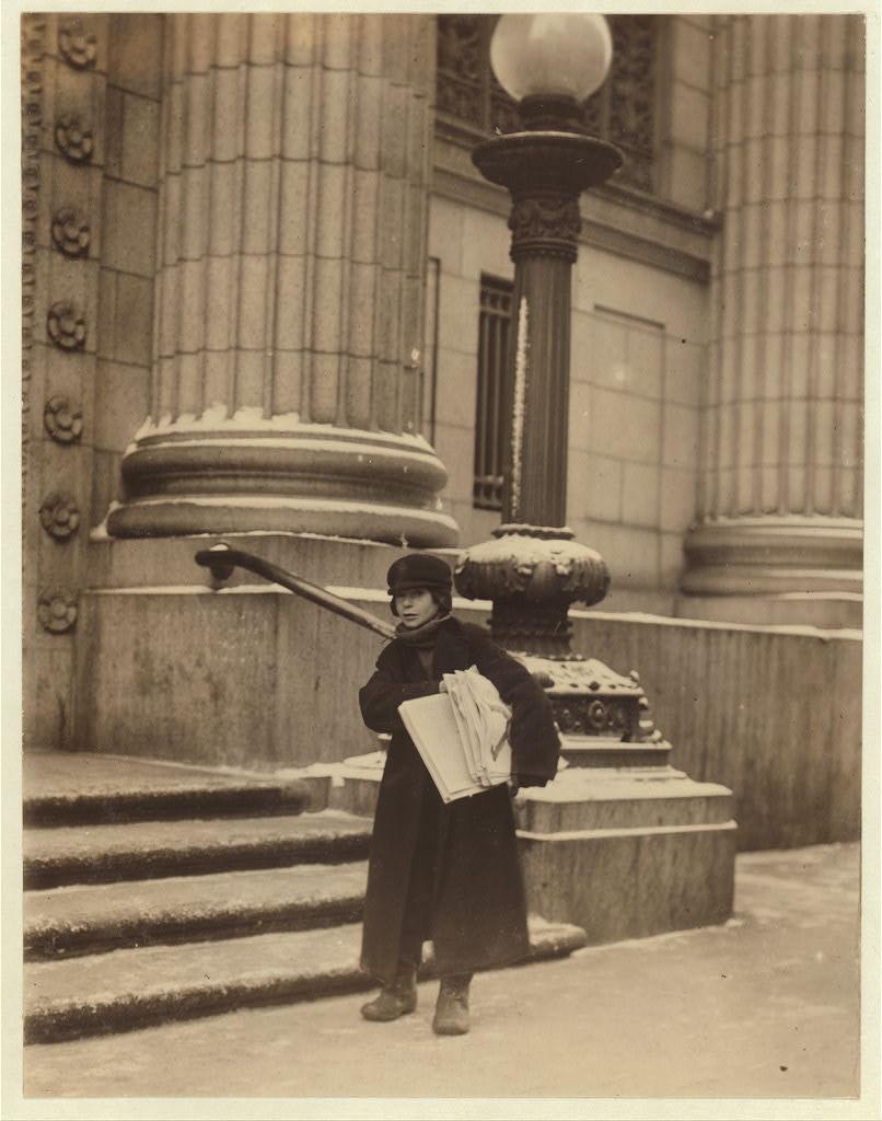 Young newspaper seller on Main Street in Rochester in February 1910.