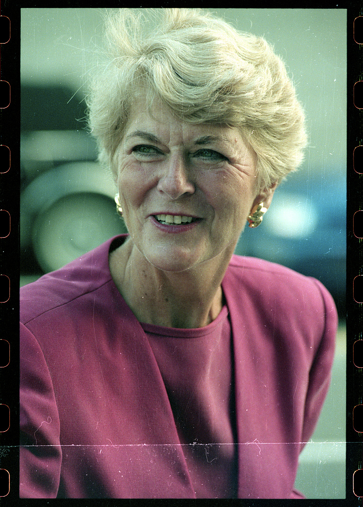 Geraldine Ferraro wearing a pink jacket in a close-up outdoor portrait.